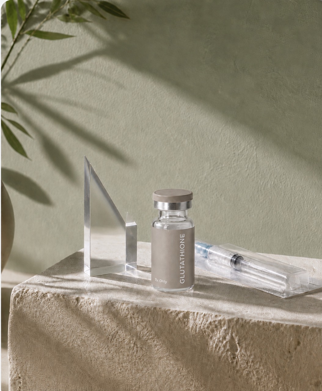 Glutathione vial and sealed administration supply in a softly lit wellness setting